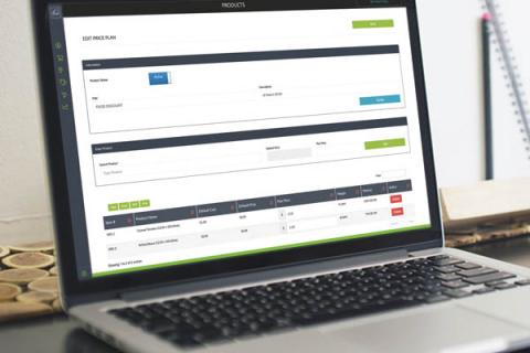 Routeique pricing plan displayed on silver laptop